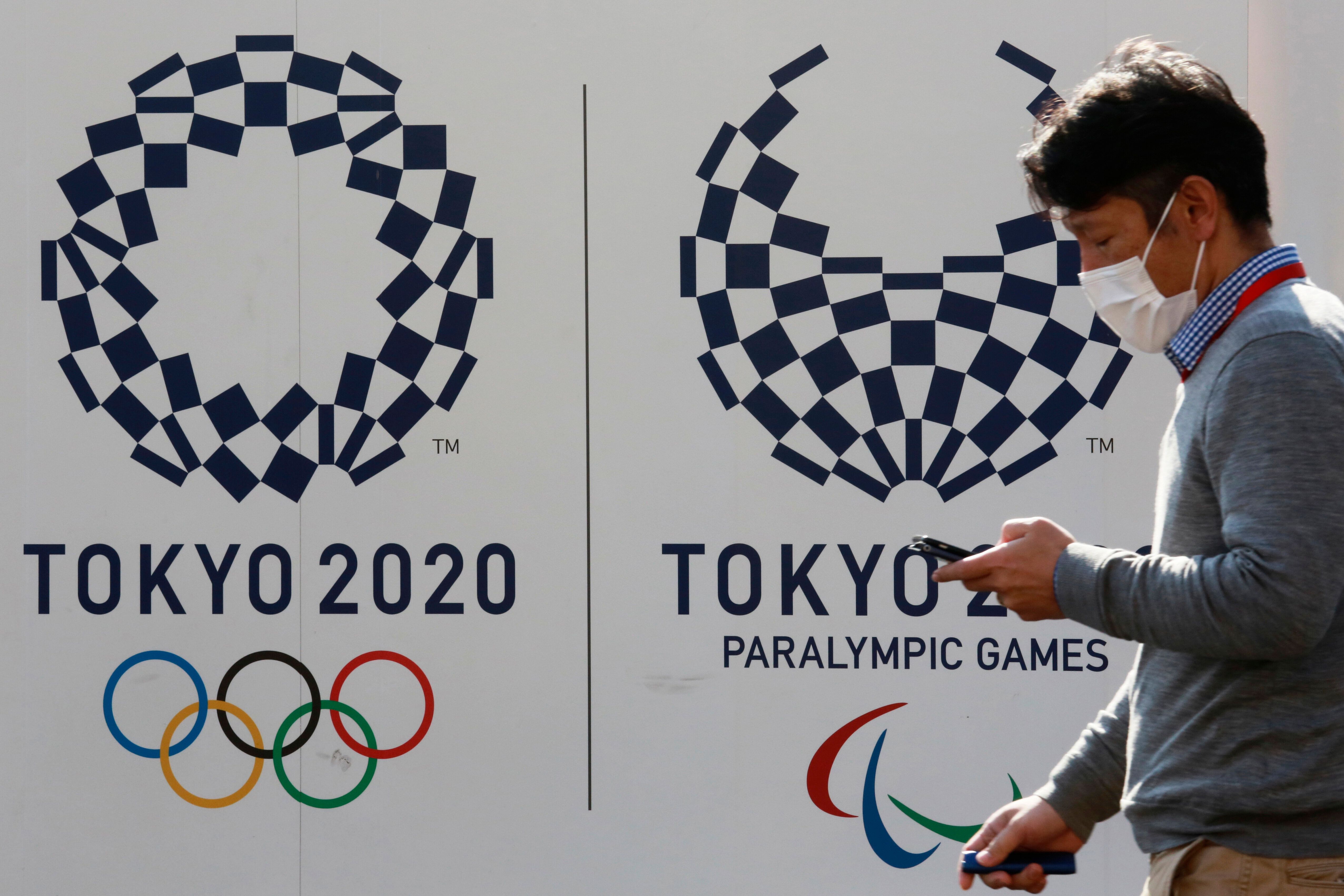 À Tokyo, les panneaux publicitaires pour les Jeux Olympiques sont partout, comme le montre cette...